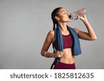 Fitness woman drinking water...