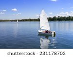 Small White Boat Sailing On The ...