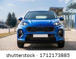 Blue business car with shiny front lights color bright