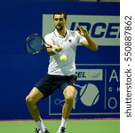 Small photo of CHENNAI, INDIA - JANUARY 4, 2017: Marin Cilic of Croatia plays against Jozef Kovalik of Slovakia in a second round match at Aircel Chennai Open tournament at SDAT Tennis Stadium in Chennai.