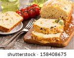 Savoury loaf cake with tomatoes, cheese and olives
