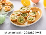 Small photo of Mini quiches with spinach for Easter brunch, quiche florentine