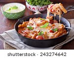 Pasta bake with whole wheat penne, tomatoes and mozarella
