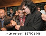 Small photo of SPITAK, ARMENIA - OCTOBER 1: Tony Iommi of Black Sabbath enjoys refreshments as he visits Spitak, Armenia on October 1, 2009 within the framework of “Armenia Grateful 2 Rock” project.