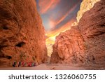 Todgha Gorge or Gorges du Toudra is a canyon in High Atlas Mountains near the town of Tinerhir, Morocco . A series of limestone river canyons, or wadi and neighbor of Dades Rivers at sunset.