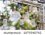 DIY old empty bottles can be used for event decoration as a flowers vases hand from bars