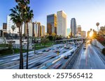 Los Angeles evening sunset highway traffic skyline buildings