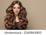 Small photo of Beautiful laughing brunette model girl with long curly hair . Smiling woman hairstyle wavy curls . Fashion , beauty and makeup portrait
