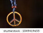 Wooden peace symbol attached to ...