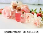 Rose spa setting aromatic water in bottles natural freshness soft delicate flowers feminine beauty