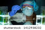 Small photo of Researcher taking ampule with transparent liquid, antitoxin studies, medication