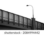 Small photo of Black and white, monochrome silhouette image of a wrought iron decorative street lamp on a bridge against the backdrop of bright, clear, white, featureless, blank summer sky. Copy space.
