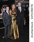 Small photo of LOS ANGELES, CA - MARCH 12, 2012: Jennifer Lawrence, Josh Hutcherson (left) & Liam Hemsworth at the world premiere of "The Hunger Games" at the Nokia Theatre L.A. Live March 12, 2012 Los Angeles, CA