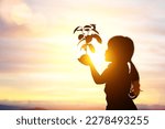 Silhouette of young asian girl...