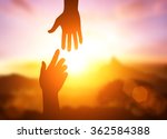 silhouette of helping hand concept and international day of peace.Thank You For Your Support. how can i help you. international day of peace.develop a friendship.please help me.