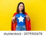 Super hero Vietnamese woman isolated  on yellow background proud and self-satisfied