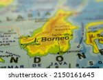 Small photo of Close-up of the orographic map of the island of Borneo in the Pacific east of the Indomalayan Peninsula with references in Spanish. Concept cartography, Travel, tourism, geography. Differential focus.