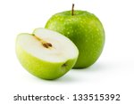 Green apples Ganny Smith covered in water droplets isolated against a white background.