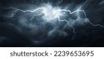 Small photo of Thunderous dark sky with black clouds and flashing lightning. Panoramic view. Concept on the theme of weather, natural disasters, storms, typhoons, tornadoes, thunderstorms, lightning, lightning.