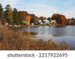 Small photo of Riverside homes in Lysander, New York on the Seneca River in autumn