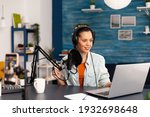 Social media influencer discussing about vlogging in home studio recording podcast. New media star making online fashion content with professional equipment for subscribers audience