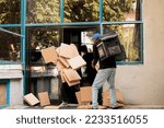 Small photo of Reckless courier dropping pizza boxes pile at client, clumsy courier carrying office food order outdoors. Bad delivery service, careless clumsy man with falling fastfood packages stack