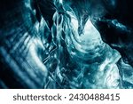 Small photo of Vatnajokull glacier rocks with ice caves in icelandic landscape, beautiful nordic scenery with frozen iceberg mass. Transparent blue rocks in path with covered frost created by crevasse.
