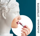 Contemporary collage of plaster statue head and young woman with lipstick in profile over deep blue background. Antiquity and modernity, beauty canons