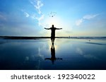 Silhouette of Man Raising His Hands or Open arms when sun rising up