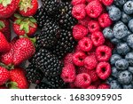 Fresh Summer Berries mix Background with Strawberry, Raspberry, Red currant, Blueberry and Blackberry.