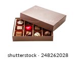 Assorted chocolates in brown box, with lid half off