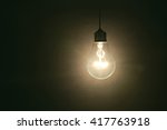 Light Bulb On Dark Background ...