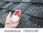Hail in hand on a rooftop after hailstorm