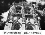 Ornate bell tower of St Mary Magdalene Church in Verneuil-sur-Avre, Eure, Normandy,  France.   Flamboyant Gothic style architecture. Black white historic photo