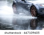 Sports Car Driven On Rainy...