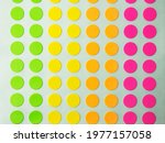 Sheet of circle labels or dot sticker in various neon colors. 
also called coding Dot Labels. Close-up macro from above. 