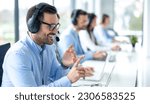 Small photo of Professional customer support agent man counting on fingers while assisting customers at call center office, with colleagues in the background.