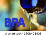 Small photo of Plastic bottle and liquid stream. Bisphenol, text BPA FREE plastic photo