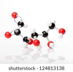 Small photo of Molecule of glucose, also known as dextrose or grape sugar, molecular formula C6H12O6. Carbon represented by black balls, oxygen by red, Hydrogen by the white balls attached to the carbon or oxygen.