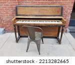 Old Upright Piano Next To Brick ...