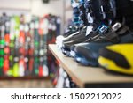 Sport equipment store interior with large assortment of modern ski boots