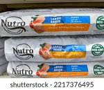 Small photo of Plymouth, Minnesota - October 14, 2022: Nutro Natural dog food - puppy chicken and rice flavor, for sale at a Petsmart store