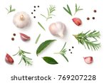 Garlic, rosemary, bay leaves, allspice and pepper isolated on white background. Flat lay. Top view 