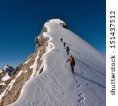 Tied Climbers Climbing Mountain ...