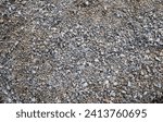 Small photo of Grey ground stone rubble road background. Natural gray granite chippings, macadam, rubble or crushed stones texture, top view