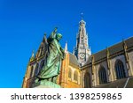 Statue of Laurens Janszoon Coster and Saint Bavo church in Haarlem, Netherlands