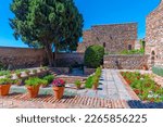 view of a garden of the alcazaba fortress in the spanish city malaga