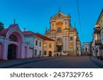 Small photo of Vilnius, Lithuania, July 7, 2022: Night view of a street leading towards The Church of St Theresa in Vilnius, Lithuania..