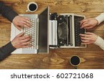 Woman writing on a typewriter and a man working on a laptop.Closeup to hands.Technological evolution.