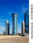 Small photo of DOHA, QATAR - JUN 17: 200 m tall "Tornado Tower" of the West Bay on Jun 17, 2013 in Doha. The hyperbolic shape of the tower is intended to represent a desert whirlwind, hence the name "Tornado Tower"